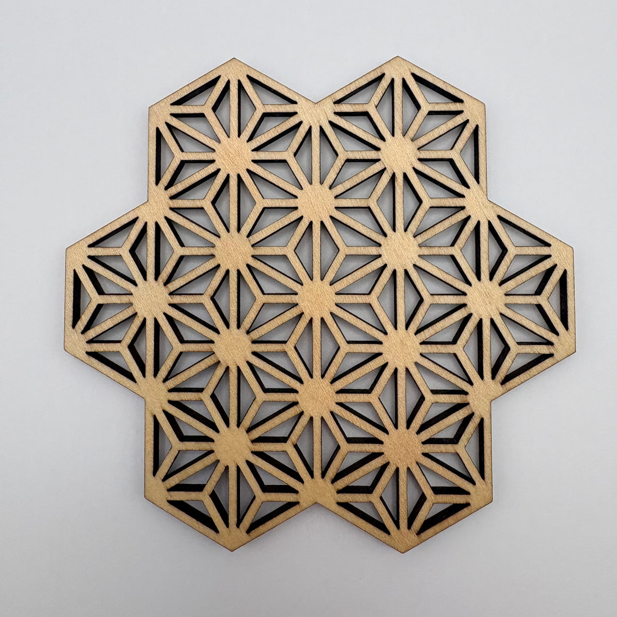 Asanoha (star) pattern coaster — for healthy, upright growth